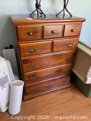 MaxSold Auction: Wooden Chest of Drawers with Seven Drawers and Metal Pulls - Leeds And The Thousand Islands (Ontario, Canada) PARTNER MANAGED Downsizing Online Auction - Main Street