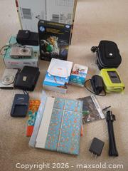 MaxSold Auction: Mixed Compact Digital Cameras with HP Sprocket Printer & Accessories - Saanich (British Columbia, Canada) PARTNER MANAGED Moving Online Auction - Cordova Bay Road (CONDO)