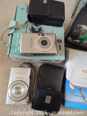 MaxSold Auction: Mixed Compact Digital Cameras with HP Sprocket Printer & Accessories - Saanich (British Columbia, Canada) PARTNER MANAGED Moving Online Auction - Cordova Bay Road (CONDO)