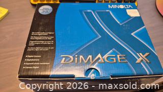 MaxSold Auction: Vintage Minolta DiMAGE X 2.0MP Digital Camera, 3x Optical Zoom, Silver - Toronto (Ontario, Canada) PARTNER MANAGED Estate Sale Online Auction - Yorkville Avenue (CONDO) PART 2