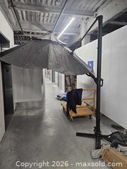 MaxSold Auction: Used Patio Offset Umbrella with weighted base assembly and cover - Mississauga (Ontario, Canada) SELLER MANAGED Reseller Online Auction - Platinum Drive (STORAGE)