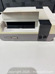 MaxSold Auction: Vintage Nintendo NES-001 1985 (Nintendo Entertainment System) Console - Warwick (Rhode Island, USA) SELLER MANAGED Reseller Online Auction - Warwick Avenue