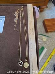 MaxSold Auction: 14K Gold Stamped Coin Pendant Necklaces (Multiple) - Aurora (Colorado, USA) SELLER MANAGED Estate Sale Online Auction - East Lasalle Place