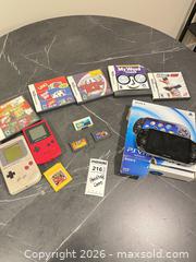 MaxSold Auction: Mixed handheld consoles, game cartridges & PS Vita box BS1 - Richland Township (Pennsylvania, USA) PARTNER MANAGED Moving Online Auction - Winterthur Lane