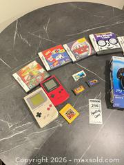 MaxSold Auction: Mixed handheld consoles, game cartridges & PS Vita box BS1 - Richland Township (Pennsylvania, USA) PARTNER MANAGED Moving Online Auction - Winterthur Lane