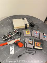 MaxSold Auction: Nintendo NES Console with 2 Controllers, Zapper & Multiple Games BS1 - Richland Township (Pennsylvania, USA) PARTNER MANAGED Moving Online Auction - Winterthur