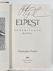 MaxSold Auction: Christopher Paolini Eragon And Eldest Signed First Editions Sold Together - Maxsold Signature - Discover collectibles, antiques, fine art and more