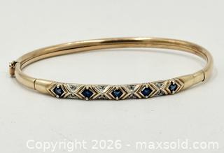 MaxSold Auction: Sapphire And Diamond Hinged Gold Bangle - Maxsold Signature - Discover collectibles, antiques, fine art and more