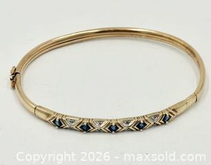 MaxSold Auction: Sapphire And Diamond Hinged Gold Bangle - Maxsold Signature - Discover collectibles, antiques, fine art and more