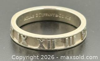 MaxSold Auction: Tiffany & Co. Atlas Narrow Band In 925 Sterling Silver ?Size 7.5 - Maxsold Signature - Discover collectibles, antiques, fine art and more