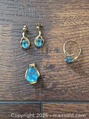 MaxSold Auction: 10KT Yellow Gold Blue Topaz Ring, Pendant and Earrings Set - Los Angeles (California, USA) PARTNER MANAGED Moving Online Auction - West 36th Street (CONDO)
