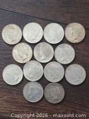 MaxSold Auction: Lot of 13 Peace Silver Dollars (1922–1935) 90% Silver - Los Angeles (California, USA) PARTNER MANAGED Moving Online Auction - West 36th Street (CONDO)