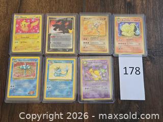 MaxSold Auction: Lot of 7 Pokémon Cards (English & Japanese) with Toploaders - Los Angeles (California, USA) PARTNER MANAGED Moving Online Auction - West 36th Street (CONDO)