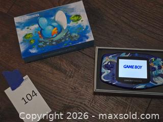MaxSold Auction: Nintendo Game Boy Advance Pokémon Mudkip Artwork (Blue Translucent) - Los Angeles (California, USA) PARTNER MANAGED Moving Online Auction - West 36th Street (CONDO)