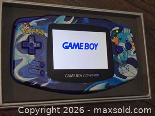 MaxSold Auction: Nintendo Game Boy Advance Pokémon Mudkip Artwork (Blue Translucent) - Los Angeles (California, USA) PARTNER MANAGED Moving Online Auction - West 36th Street (CONDO)