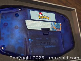 MaxSold Auction: Nintendo Game Boy Advance Pokémon Mudkip Artwork (Blue Translucent) - Los Angeles (California, USA) PARTNER MANAGED Moving Online Auction - West 36th Street (CONDO)