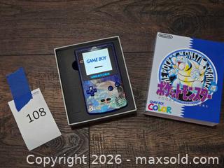 MaxSold Auction: Nintendo Game Boy Color, Transparent Blue with Pokemon Cartridge - Los Angeles (California, USA) PARTNER MANAGED Moving Online Auction - West 36th Street (CONDO)