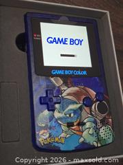 MaxSold Auction: Nintendo Game Boy Color, Transparent Blue with Pokemon Cartridge - Los Angeles (California, USA) PARTNER MANAGED Moving Online Auction - West 36th Street (CONDO)