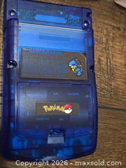 MaxSold Auction: Nintendo Game Boy Color, Transparent Blue with Pokemon Cartridge - Los Angeles (California, USA) PARTNER MANAGED Moving Online Auction - West 36th Street (CONDO)
