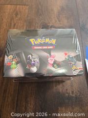 MaxSold Auction: Pokémon Unova White Flare & Black Bolt Mini Tin Display — 8 Tins - Los Angeles (California, USA) PARTNER MANAGED Moving Online Auction - West 36th Street (CONDO)