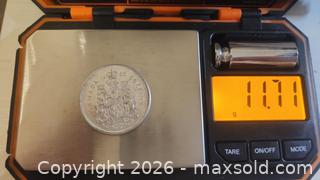 MaxSold Auction: 1965 Canadian 50-cent coin .800 SILVER Queen Elizabeth II 11.71 grams - Mississauga (Ontario, Canada) SELLER MANAGED Downsizing Online Auction - Golden Orchard Drive (CONDO)