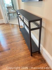 MaxSold Auction: 49 in Black Metal Modern Industrial Console Table - Frisco (Texas, USA) PARTNER MANAGED Downsizing Online Auction - Miramar Drive