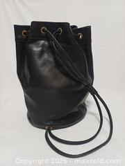 MaxSold Auction: Rare Vintage Roots Canada Large Black Leather Crossbody Bucket Bag - Toronto (Ontario, Canada) PARTNER MANAGED Reseller Online Auction - Queen Street West