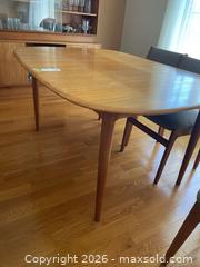 MaxSold Auction: Mid-Century Teak Oval Dining Table with Extension Leaf C - Kingston (Ontario, Canada) SELLER MANAGED Moving Online Auction - Acadia Drive