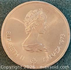 MaxSold Auction: 1973 Cdn. Silver Commemorate the 1976 Montreal Summer Olympics the Montreal Skyline and Harbor Scene 10 Dollars  - Newmarket (Ontario, Canada) PARTNER MANAGED Reseller Online Auction - Walter Avenue