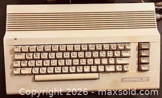 MaxSold Auction: Commodore 64 Home Computer System with a 1541 Disk Drive and Joystick (as is)  - Newmarket (Ontario, Canada) PARTNER MANAGED Reseller Online Auction - Walter Avenue
