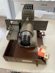 MaxSold Auction: vintage Bell & Howell TDC Vivid slide projector from the 1950s - Clarington (Ontario, Canada) SELLER MANAGED Downsizing Online Auction - Waverley Road