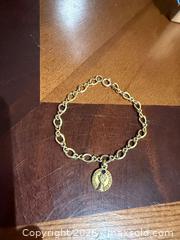 MaxSold Auction: 7-inch 10K/12K Gold Bracelet with Coin Charm, Blue Stone - Brampton (Ontario, Canada) SELLER MANAGED Charity/Fundraising Online Auction -  Pine Ridge Lane