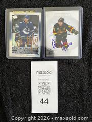MaxSold Auction: (2) QUINN HUGHES AUTOGRAPHED HOCKEY CARDS - Vancouver (British Columbia, Canada) SELLER MANAGED Reseller Online Auction - West Broadway