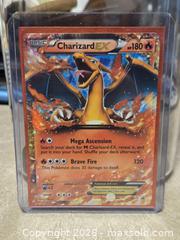 MaxSold Auction: Pokemon Charizard EX XY17 Black Star Promo NM - Toronto (Ontario, Canada) PARTNER MANAGED Downsizing Online Auction - Mcadam Avenue