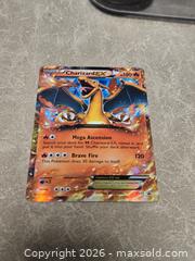 MaxSold Auction: Pokemon Charizard EX XY17 Black Star Promo NM - Toronto (Ontario, Canada) PARTNER MANAGED Downsizing Online Auction - Mcadam Avenue