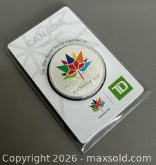 MaxSold Auction: 2017 TD Bank Canada 150th Anniversary Commemorative  1 Oz of .999 Fine Silver Coin - Toronto (Ontario, Canada) PARTNER MANAGED Reseller Online Auction - Queen Street West.