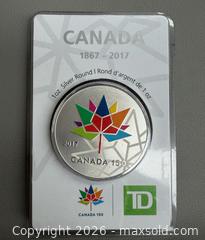 MaxSold Auction: 2017 TD Bank Canada 150th Anniversary Commemorative  1 Oz of .999 Fine Silver Coin - Toronto (Ontario, Canada) PARTNER MANAGED Reseller Online Auction - Queen Street West.