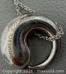 MaxSold Auction: 925 Silver Tiffany & Co. Elsa Peretti Eternal Circle Necklace in Original Packaging - Marked  - Toronto (Ontario, Canada) PARTNER MANAGED Reseller Online Auction - Queen Street West.
