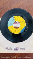 MaxSold Auction: Roger 7-inch 45 RPM Vinyl Single on Reprise (1980s) - Halton Hills (Ontario, Canada) SELLER MANAGED Downsizing Online Auction - Market Street