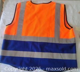 MaxSold Auction: New Zojo branded orange and navy blue high visibility safety vest size 2XL - Ottawa (Ontario, Canada) SELLER MANAGED Downsizing Online Auction - Woodpark Way