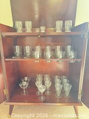 MaxSold Auction: Mid-Century Dark Walnut/Mahogany Bar Cabinet with Glassware - Tillsonburg (Ontario, Canada) SELLER MANAGED Downsizing Online Auction - Wilson Avenue