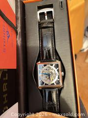 MaxSold Auction: Stuhrling Square Silver-tone Skeleton Automatic Watch - Ottawa (Ontario, Canada) PARTNER MANAGED Downsizing Online Auction - Stewart Street (CONDO)