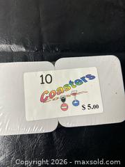 MaxSold Auction: Set of 10 Printed Felt & Cardboard Square Coasters - Grand Blanc Township (Michigan, USA) SELLER MANAGED Downsizing Online Auction - E Baldwin Road