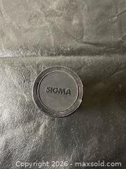 MaxSold Auction: Sigma 35-135mm f/3.5-4.5 Zoom Lens for Minolta A / Sony A - Grand Blanc Township (Michigan, USA) SELLER MANAGED Downsizing Online Auction - E Baldwin Road