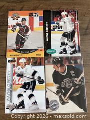 MaxSold Auction: 4 Wayne Gretzky Hockey Cards - Ottawa (Ontario, Canada) SELLER MANAGED Reseller Online Auction - Canadian Shield Avenue (CONDO)
