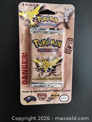 MaxSold Auction: POKEMAN TRADING CARD GAME - NEVER OPENED, NEVER USED - Hamilton (Ontario, Canada) SELLER MANAGED Downsizing Online Auction - James Street North