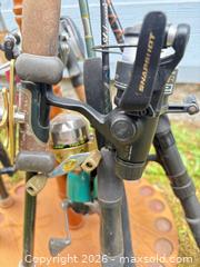 MaxSold Auction: Lot of 9 Fishing Rods, Reels and Wooden Rod Rack - Port Orchard (Washington, USA) SELLER MANAGED Downsizing Online Auction - Southwest Pine (STORAGE)