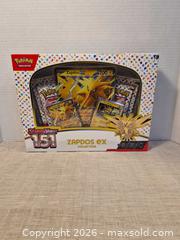 MaxSold Auction: Pokémon Scarlet & Violet - 151 Zapdos Collector Tin - Toronto (Ontario, Canada) SELLER MANAGED Downsizing Online Auction -  Rutland Street
