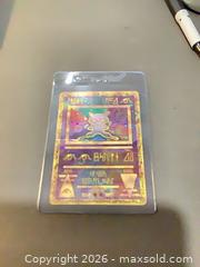 MaxSold Auction: Pokemon Ancient Mew Promo Holo (Wizards of the Coast 1999-2000)Only given Movie Premier  - Ottawa (Ontario, Canada) SELLER MANAGED Downsizing Online Auction - Oaklawn Crescent