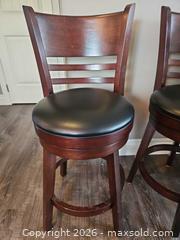 MaxSold Auction: Set of 2 Wooden Swivel Bar Stools with Black Padded Seats - Centre Hastings (Ontario, Canada) PARTNER MANAGED Estate Sale Online Auction - Mckenzie Street